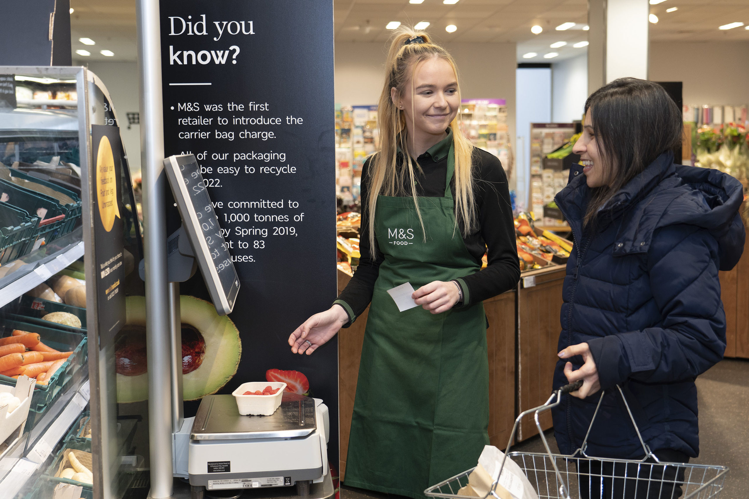 m-and-s-tolworth-greengrocer-lauren-nichols-helps-customer-weigh