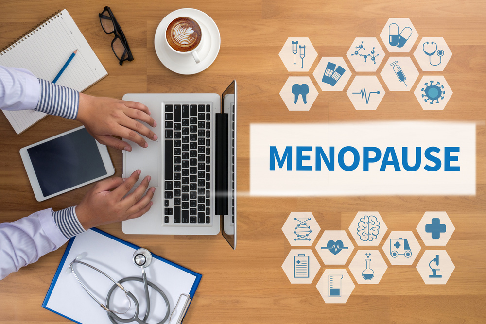 MENOPAUSE Professional doctor use computer and medical equipment all around, desktop top view, coffee