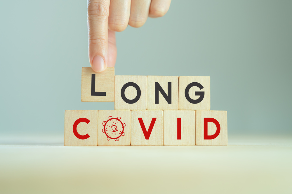 Long covid, post covid concept. Long-term effects of coronavirus. Chronic fatigue or weakness, feeling tired easily. Medical, treatment for long covid symstoms, tips for recovery.
Wooden cube blocks.