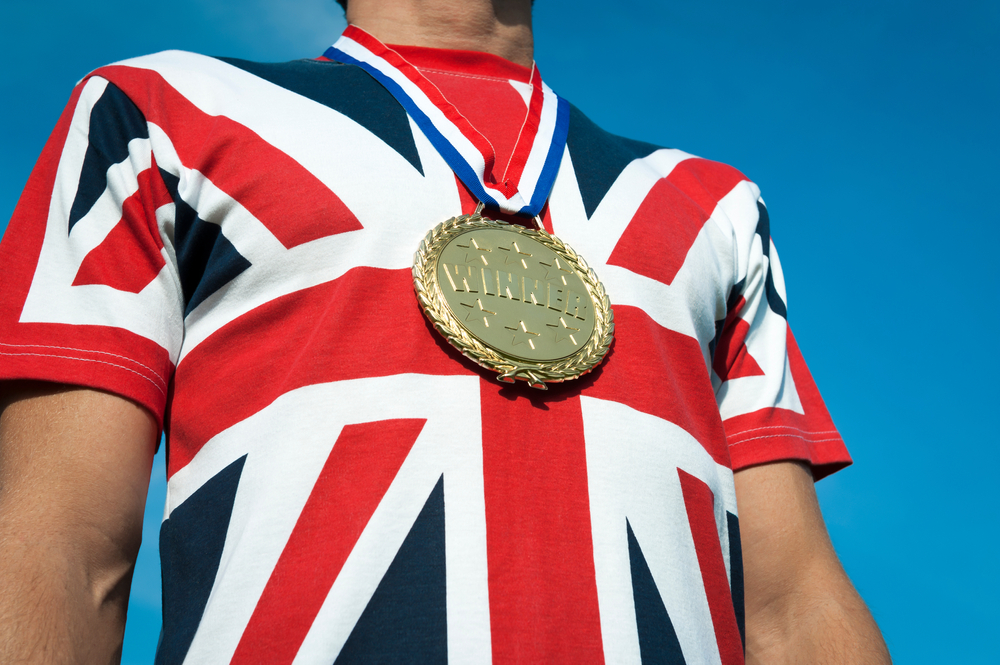 Unrecognizable,British,Man,Celebrating,A,Gold,Medal,Win,In,A