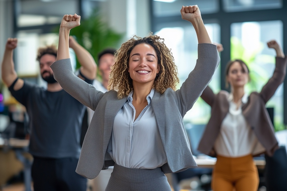 Office workers from different backgrounds engaged in group stretching exercises during a break