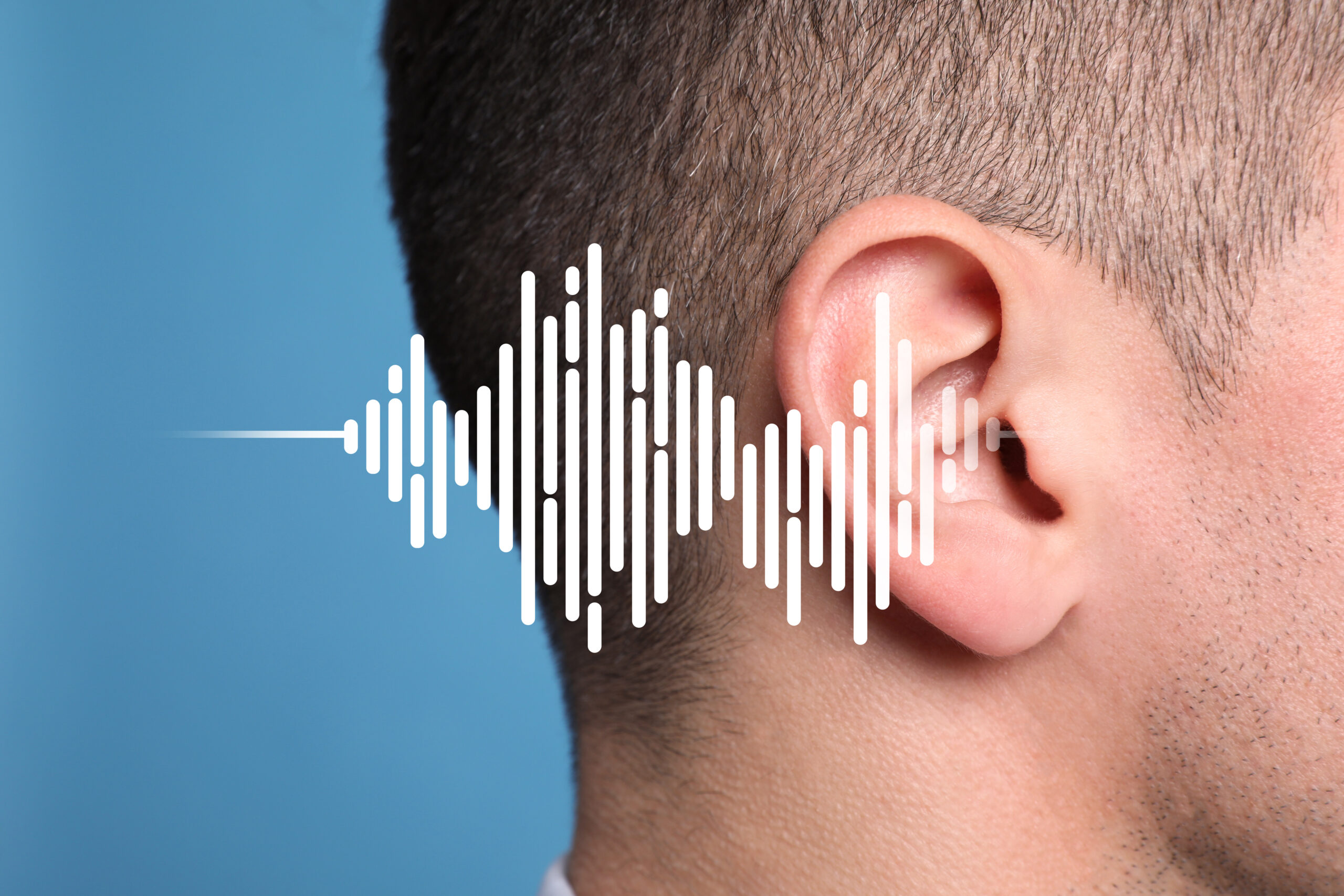 Hearing loss concept. Man and sound waves illustration on light blue background, closeup