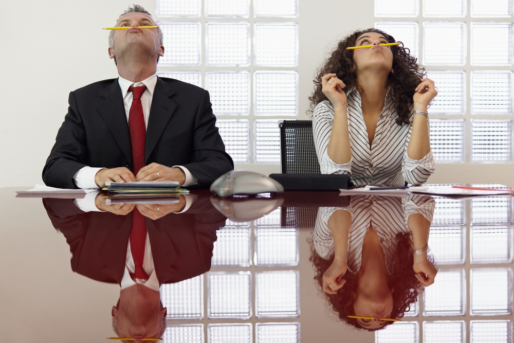 Frustrated colleagues playing at conference call
