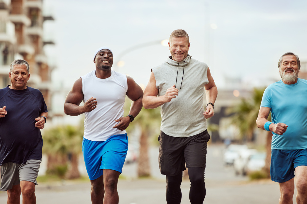 Fitness, running and teamwork with senior friends in city for stamina, cardio or endurance training. Sport, jogging and goal with group of men runner sprinting in town for workout, exercise or health