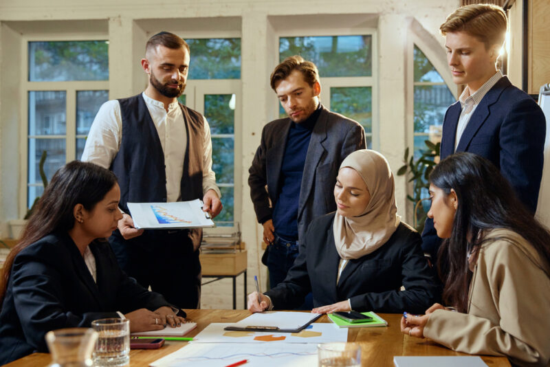 Diverse team in discussion, illustrating data-informed DEI decision-making