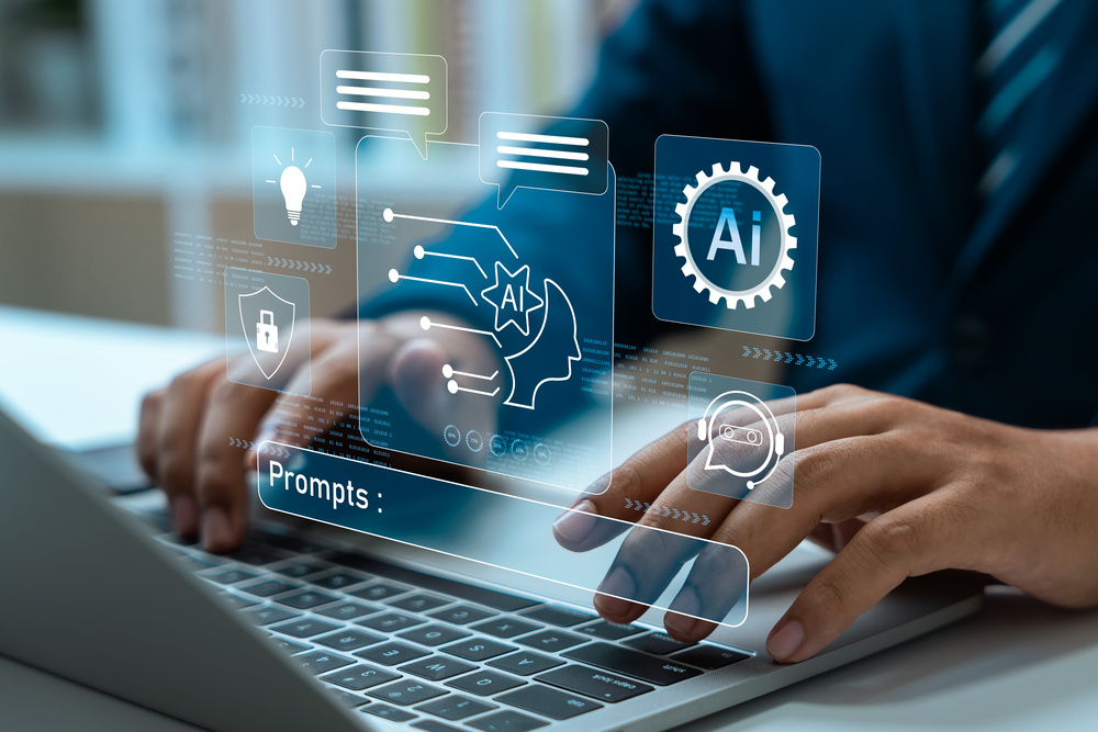 Professional using AI tools on a laptop, representing the growing role of artificial intelligence in supporting workforce health, culture and risk management at work.