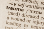 The word “trauma” in a dictionary with its definition visible