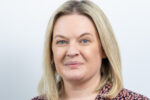 Portrait of Sarah McIntosh, Chief Executive of MHFA England, author of the article on psychological safety at work.