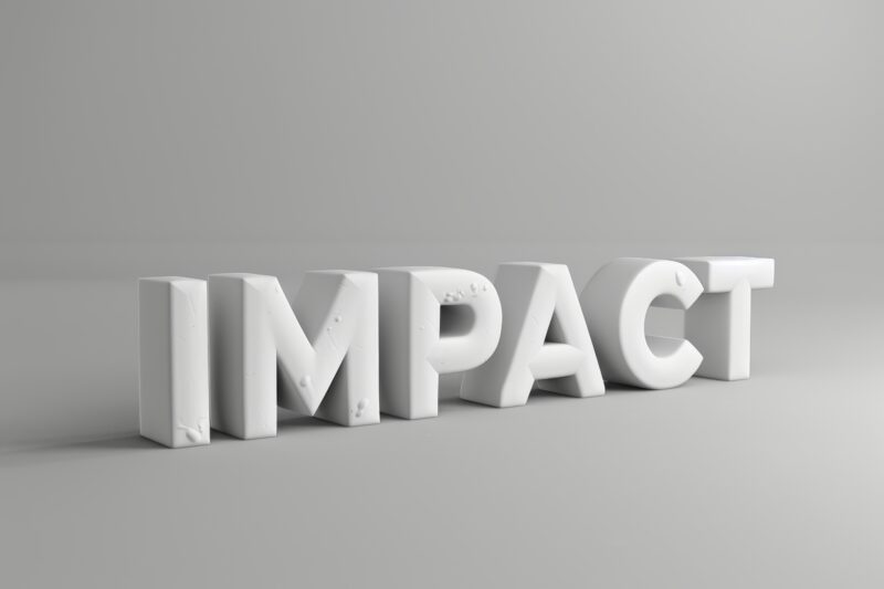 Word “impact” cast in concrete representing lasting change in workplace culture and employee health and wellbeing