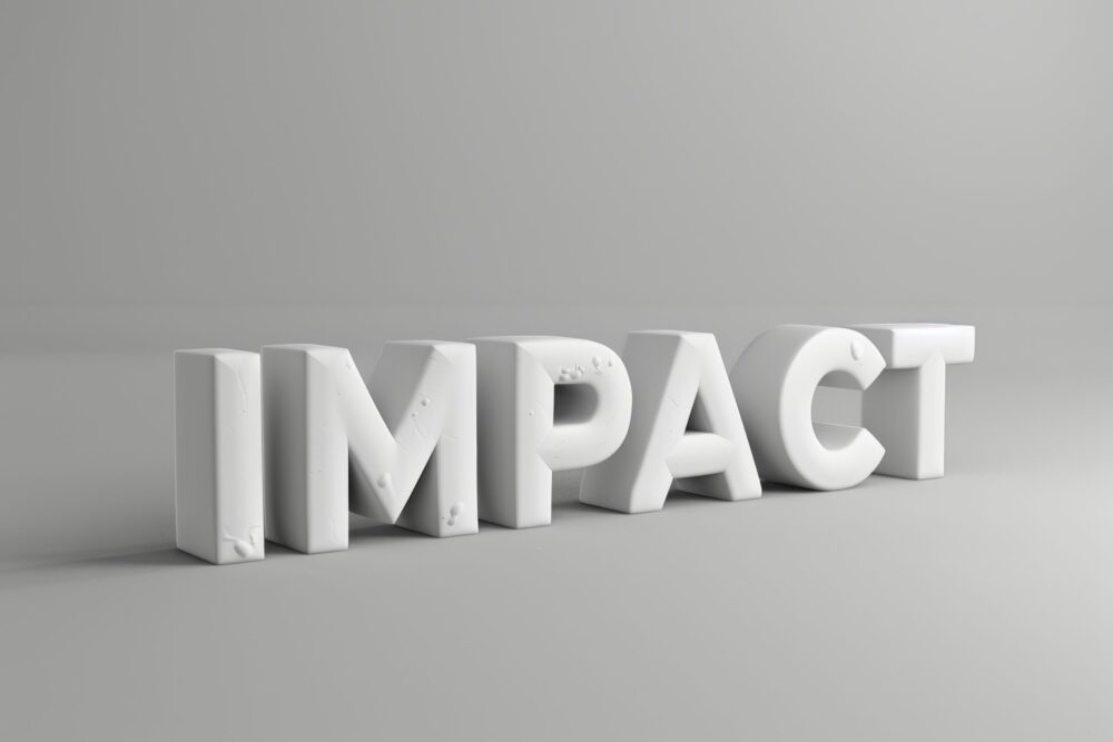 Word “impact” cast in concrete representing lasting change in workplace culture and employee health and wellbeing