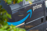 Amazon delivery van on the road, representing the company’s investment in employee mental health and enhanced EAP support through Grow Therapy