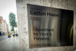 Department for Work and Pensions (DWP) sign outside a UK government building, representing new return-to-work benefits reforms