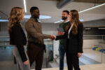 Business people closing a deal with a handshake