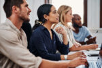 Professionals attending a workplace wellbeing training session