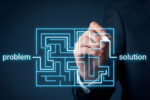 Person tracing a route through a digital maze from problem to solution, representing employee health care navigation.