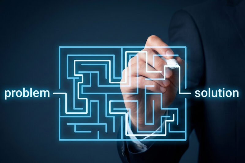 Person tracing a route through a digital maze from problem to solution, representing employee health care navigation.