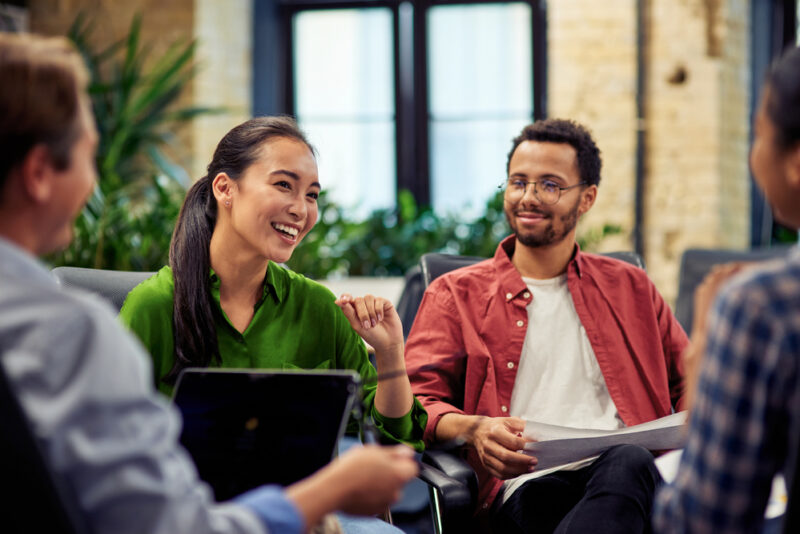 Colleagues taking part in a workplace discussion during a team meeting
