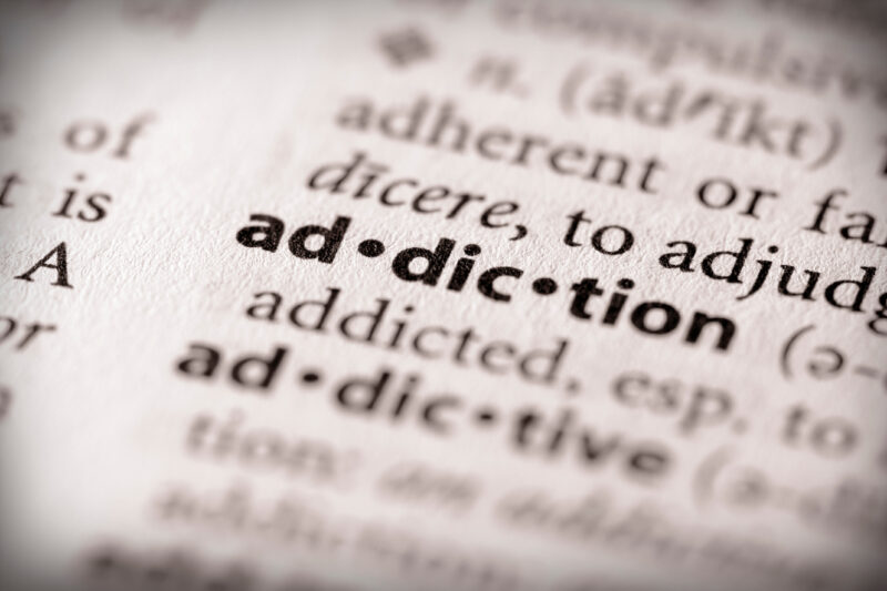 The word addiction in bold in a dictionary