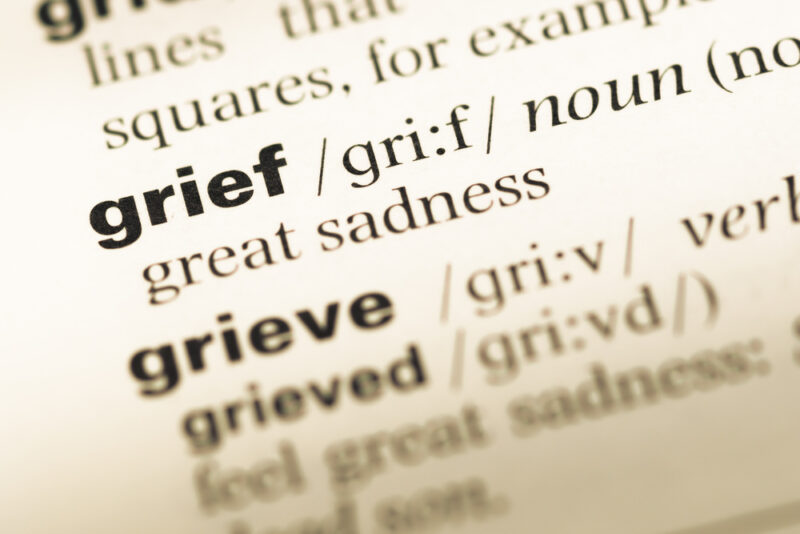 The page from a dictionary showing the definition of the words grief and grieve