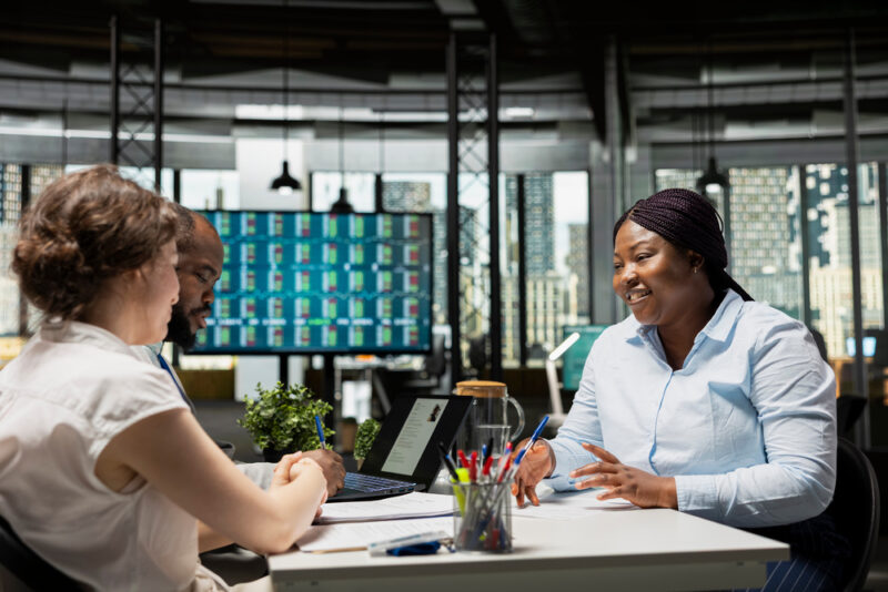 Colleagues talking together during a workplace meeting