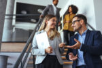 Colleagues talking together in a workplace