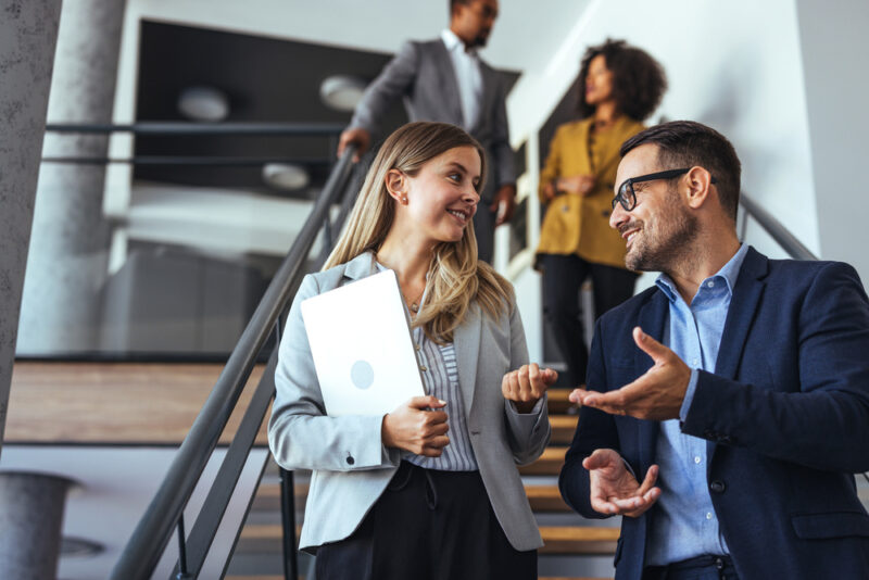 Colleagues talking together in a workplace
