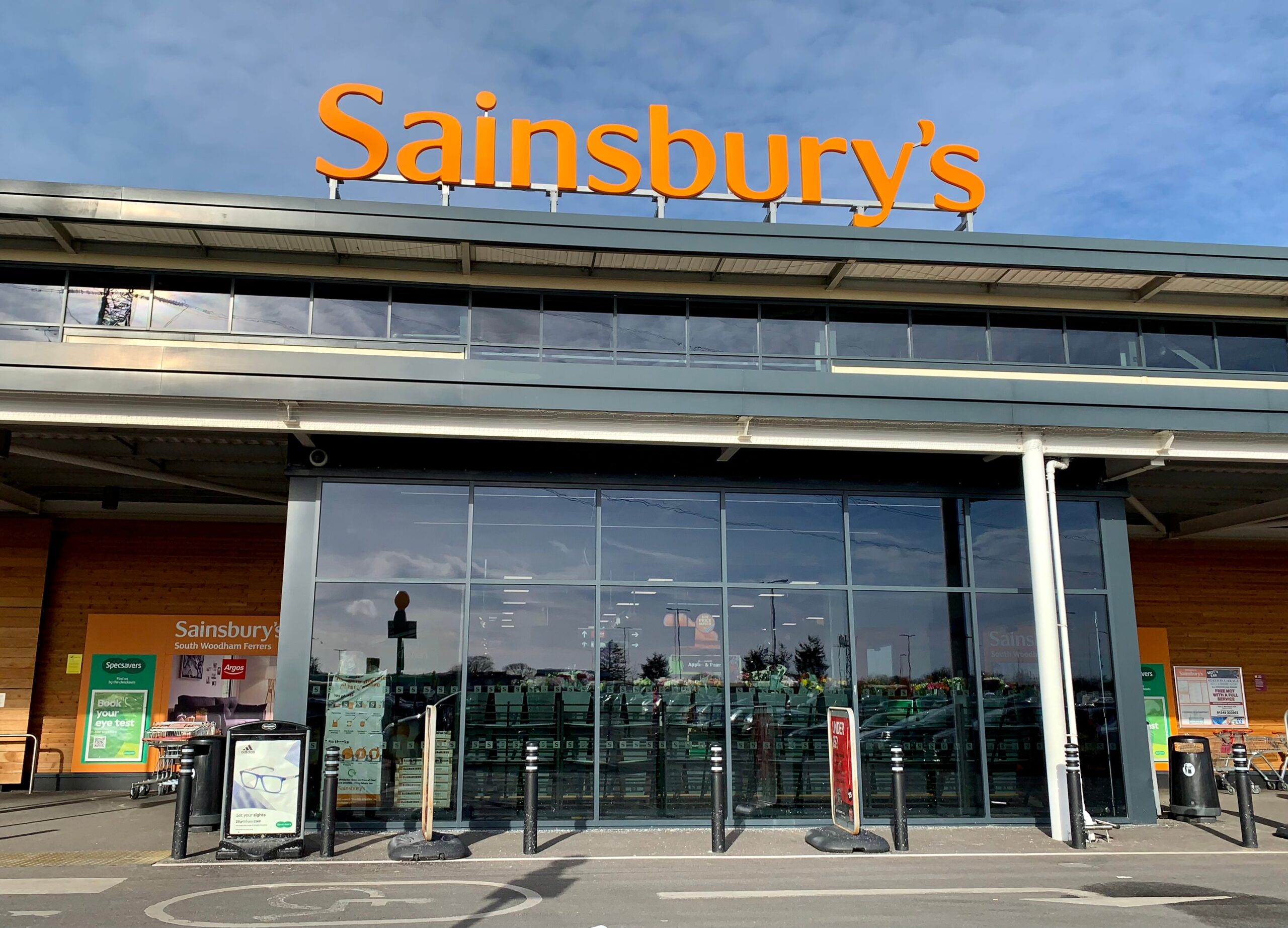 Sainsbury’s supermarket exterior with the company logo prominently displayed.